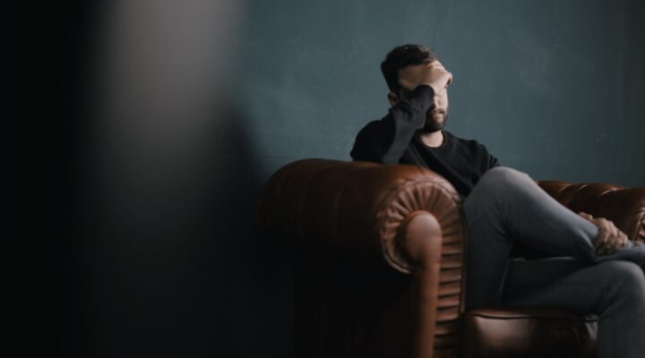 worried man on a couch