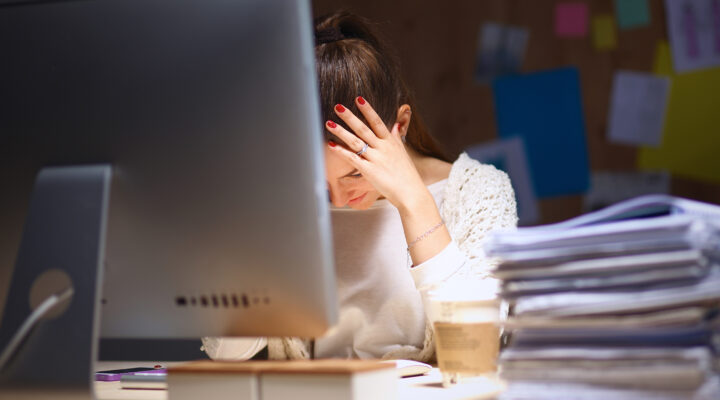 Stressed person at a computer