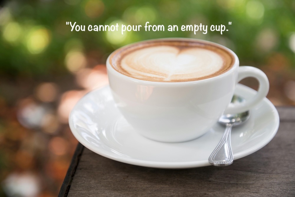 An image of a cappuccino with a heart shaped out of cream with the quote "You cannot pour from an empty cup." 